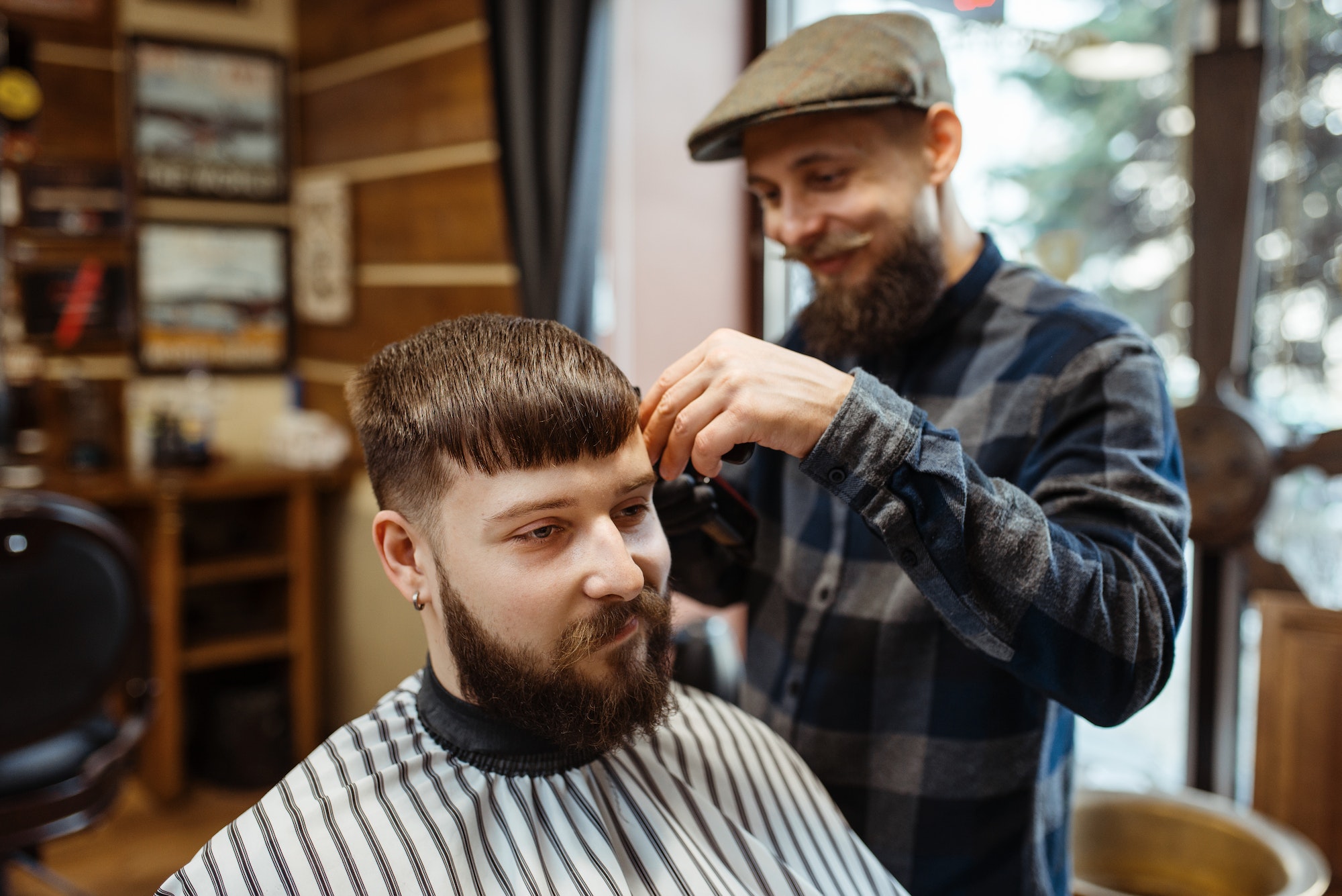 barber-in-hat-cuts-the-client-39-s-hair-barbershop.jpg